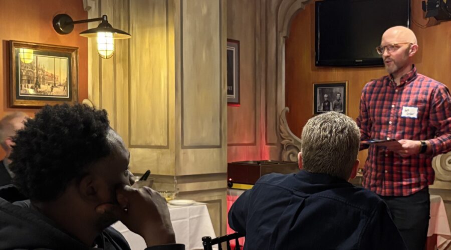 Nate Gruber speaking to men at the Milwaukee men's gathering