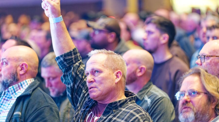 Man worshipping at a conference