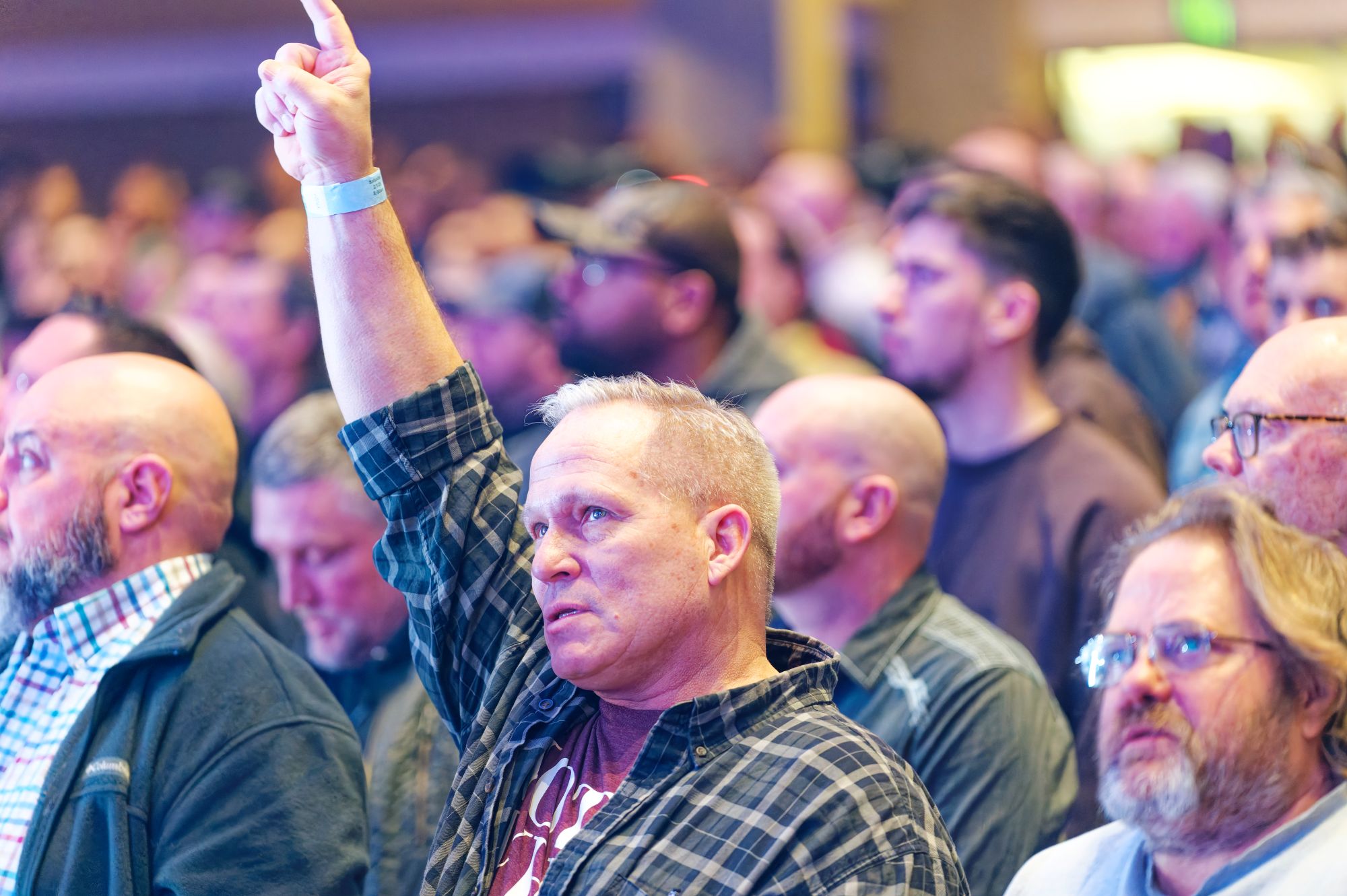 Man worshipping at a conference
