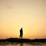 Man looking at a sunrise - Get Real: Living Congruent with Our Design