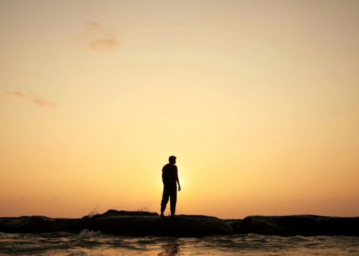 Man looking at a sunrise - Get Real: Living Congruent with Our Design