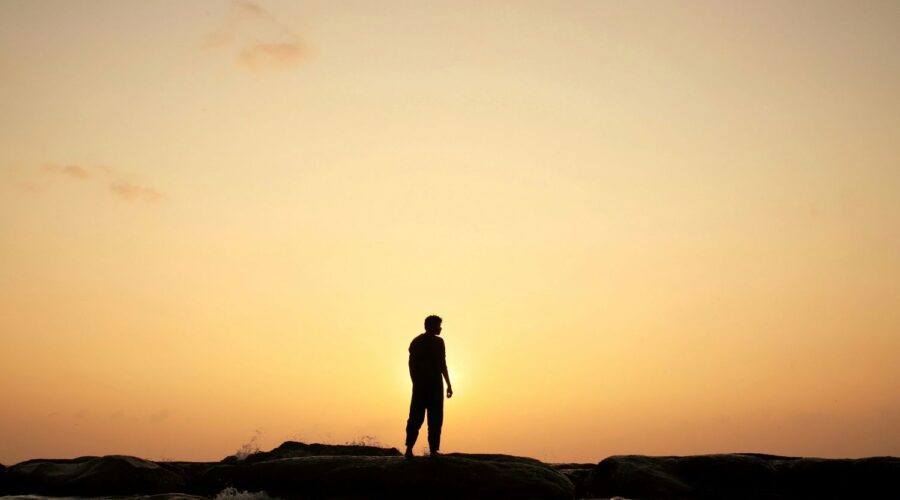 Man looking at a sunrise - Get Real: Living Congruent with Our Design