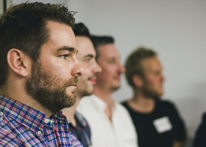 Men standing together - The Zacchaeus Principle: Reaching Men Where They Are